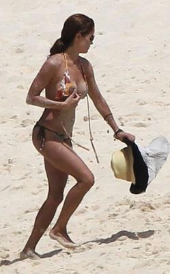 Brooke Burke bikini won&#;t hold her huge tits in