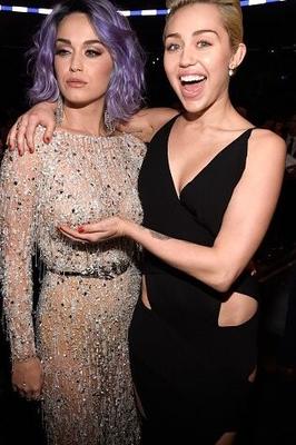 Katy Perry lets Miley Cyrus play with her boob