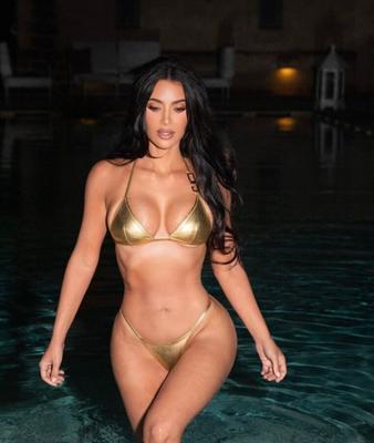 Kim Kardashian in a gold bikini