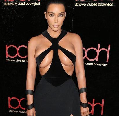 Kim Kardashian- Style Icon almost Topless in Boob Exposing Dress