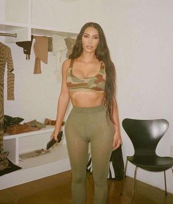 KIM KARDASHIAN CLEAVAGE IN A TIGHT CAMOUFLAGE DRESS