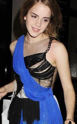 Emma Watson shows skin in her torn up dress